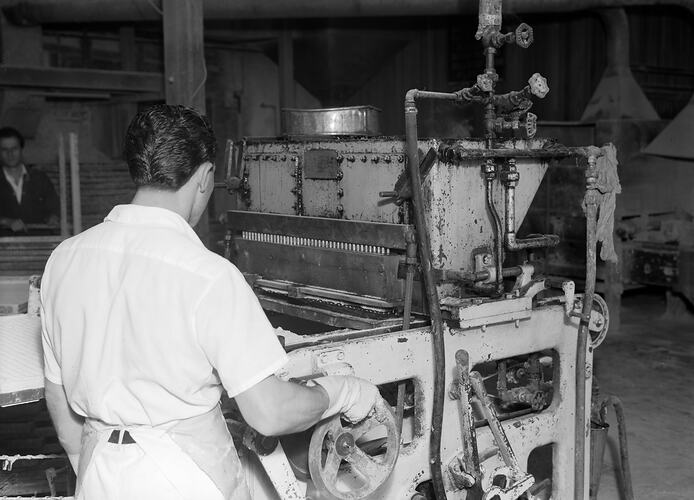 MacRobertson's Pty Ltd, Worker using Machinery in Factory, Fitzroy, Victoria, Oct 1954