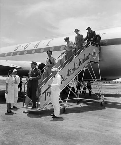 Trans Australia Airlines, Group of Men Exiting Aeroplane, Essendon Airport, Victoria, Dec 1955
