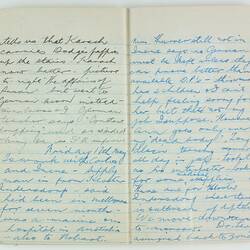 Open book, 2 cream pages. Cursive handwritten text in black/blue ink. Page 76 and 77.