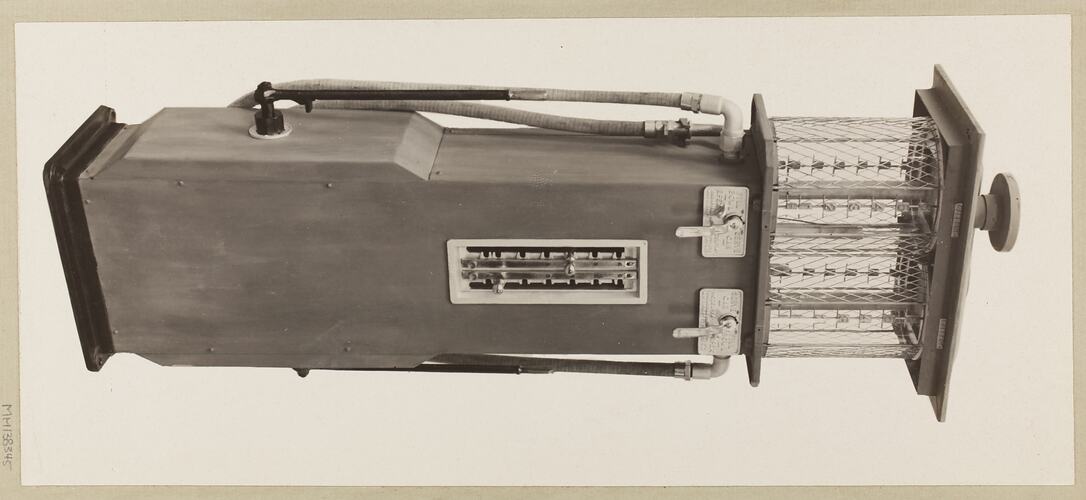 Monochrome photograph of a twin cylinder petrol pump.