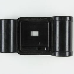 Plastic film cartridge with two cylindicral ends.