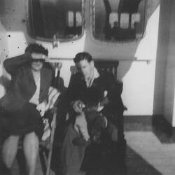Digital Photograph - Sylvia & James Forbes Seated Deckside, Onboard Fair Sky, Sitmar Line, Jul 1961