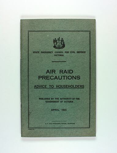 Front cover of green booklet with writing throughout