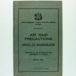 Front cover of green booklet with writing throughout