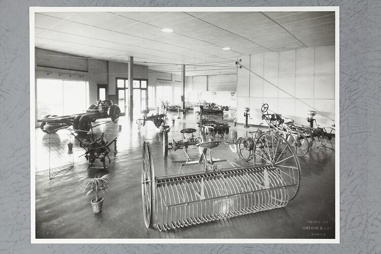 Monochrome photograph of a showroom interior.
