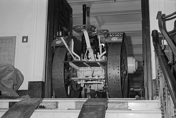 Staff removing 1915 Titan tractor (ST 26697) from South Rotunda, Science Museum, 1970s
