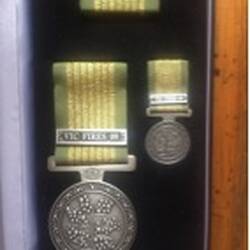 Photograph of Medal - National Emergency Medal Awarded Posthumously to Peter Auty, CFA volunteer, Flowerdale,