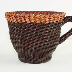 Woven and braided leather tea cup.