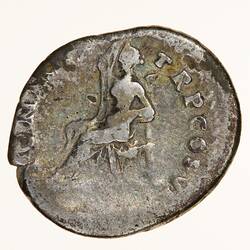 Round coin, aged, seated figure, facing left, right hand raised to head, left arm rested on chair.
