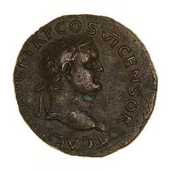 Round coin, aged, male profile, facing right, wearing headdress.