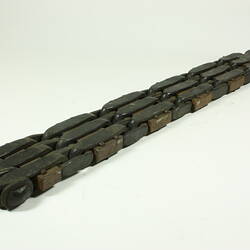Metal chain with square links.