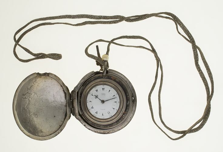 Gentleman's pocket watch in case and attached to silver plaited chain.