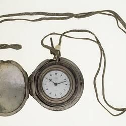 Gentleman's pocket watch in case and attached to silver plaited chain.
