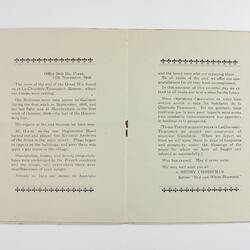 Centre pages of booklet with black printing and single staple.