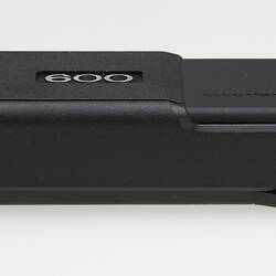 Long rectangular black plastic camera.
