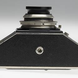 Underside of black plastic camera.