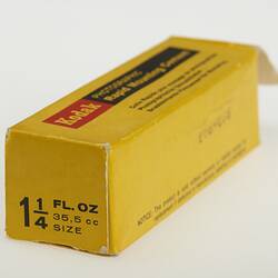 Side view of yellow rectangular cardboard box.