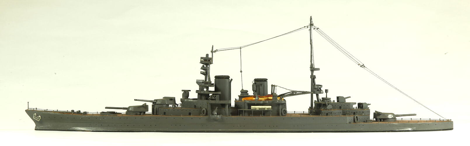 Naval ship with two masts, facing left.