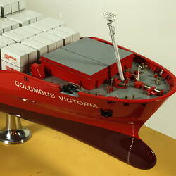 Container ship with red hull, detail of front deck.