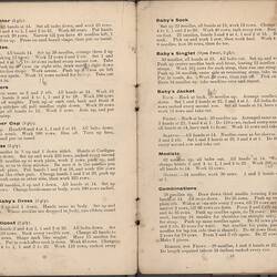 Open booklet with off-white pages and black printed text.