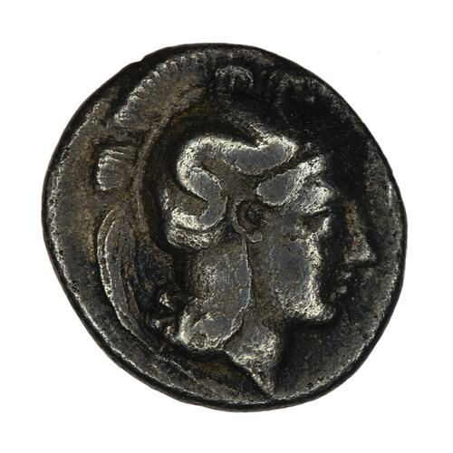 Head of Goddess Athena facing right wearing crested helmet decorated with hippocamp (sea horse).
