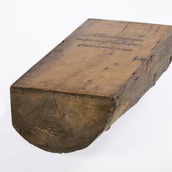 Irregularly shaped timber sample. Smooth on top.