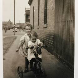 Photograph - Kay & James Morgan Riding a Tricycle, Likely Albert Park, circa 1943