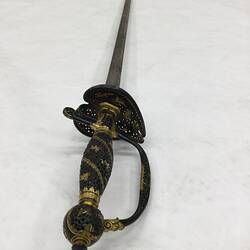 Top view of sword. Decorative handle.