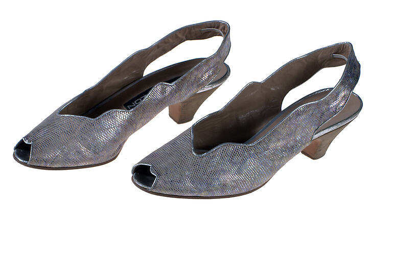 Pair of silver slingback shoes.