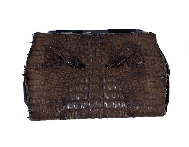 Brown crocodile skin handbag.
