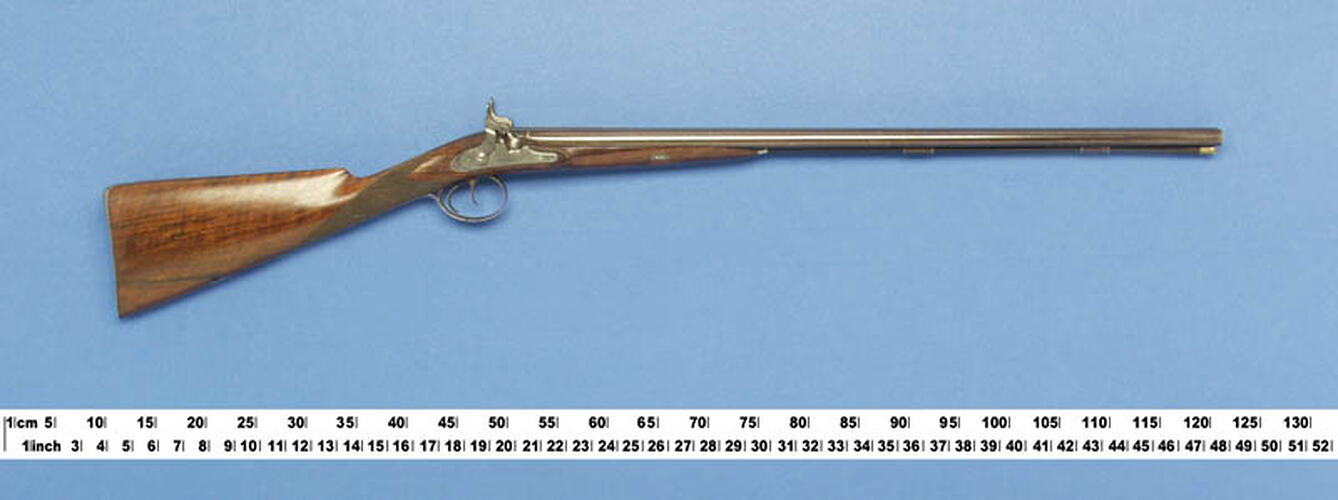 Long, thin, double barrelled shotgun