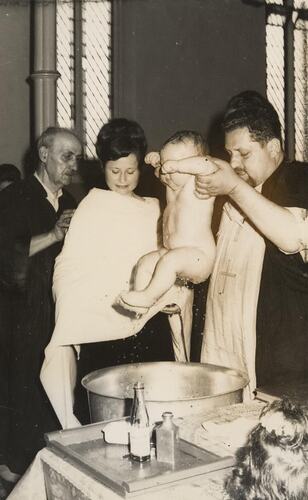 Digital Photograph - Baby being Lifted from Front at Baptism, Carlton, circa 1968