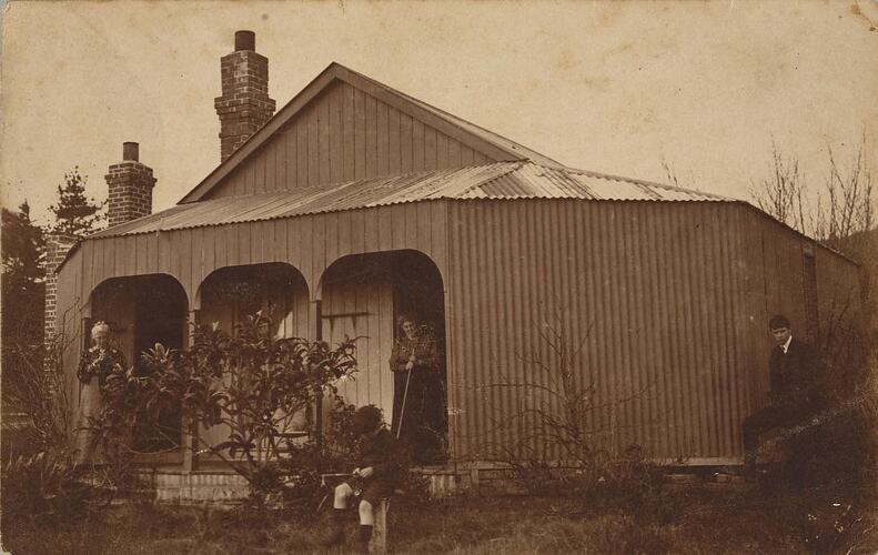 Digital Photograph - Two Women and Two Boys outside House with Corrugated Iron Verandah, circa 1910