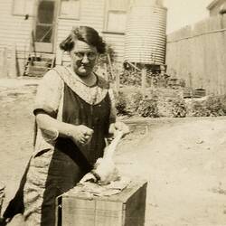 Woman in Apron Plucking a Duck, Backyard, Brunswick, circa 1930