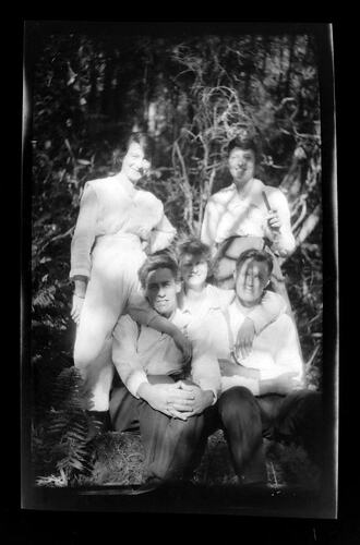 Portrait of three women and two men.