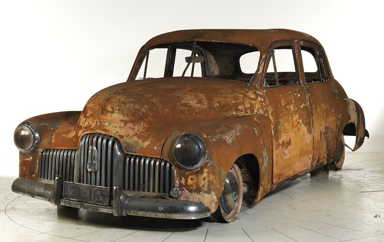Burnt car with no windows or tyres.