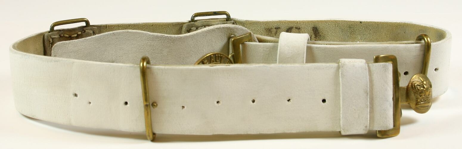 White belt with brass components.