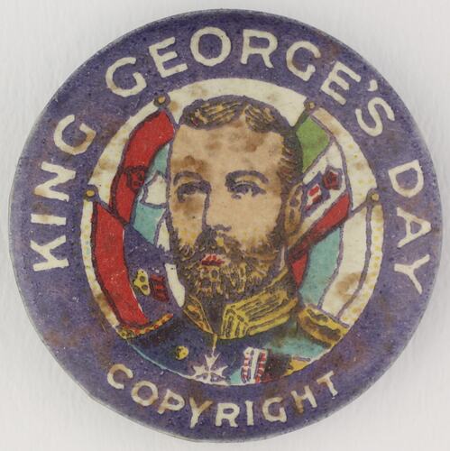 Round badge with head surrounded by various flags.