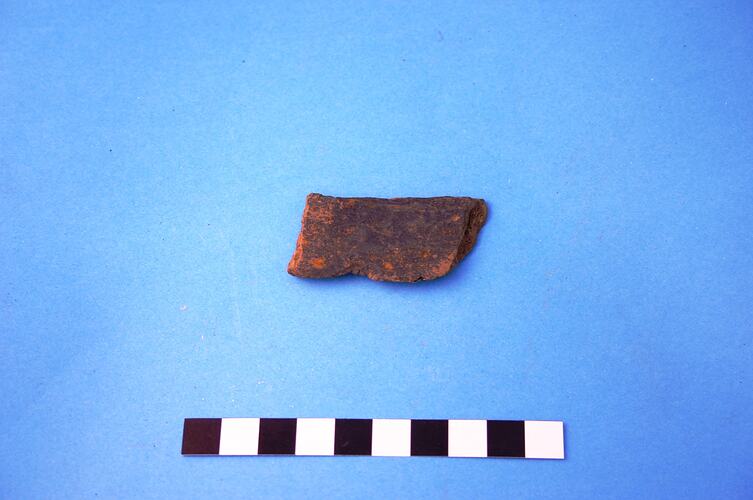 A fragment of slate roofing tile.