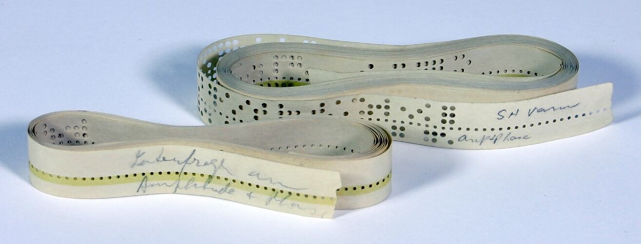 Two five hole paper tapes