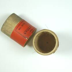 Wooden cylindrical container with detachable lid.