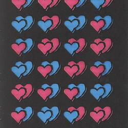 Promotional poster with pink and blue hearts.