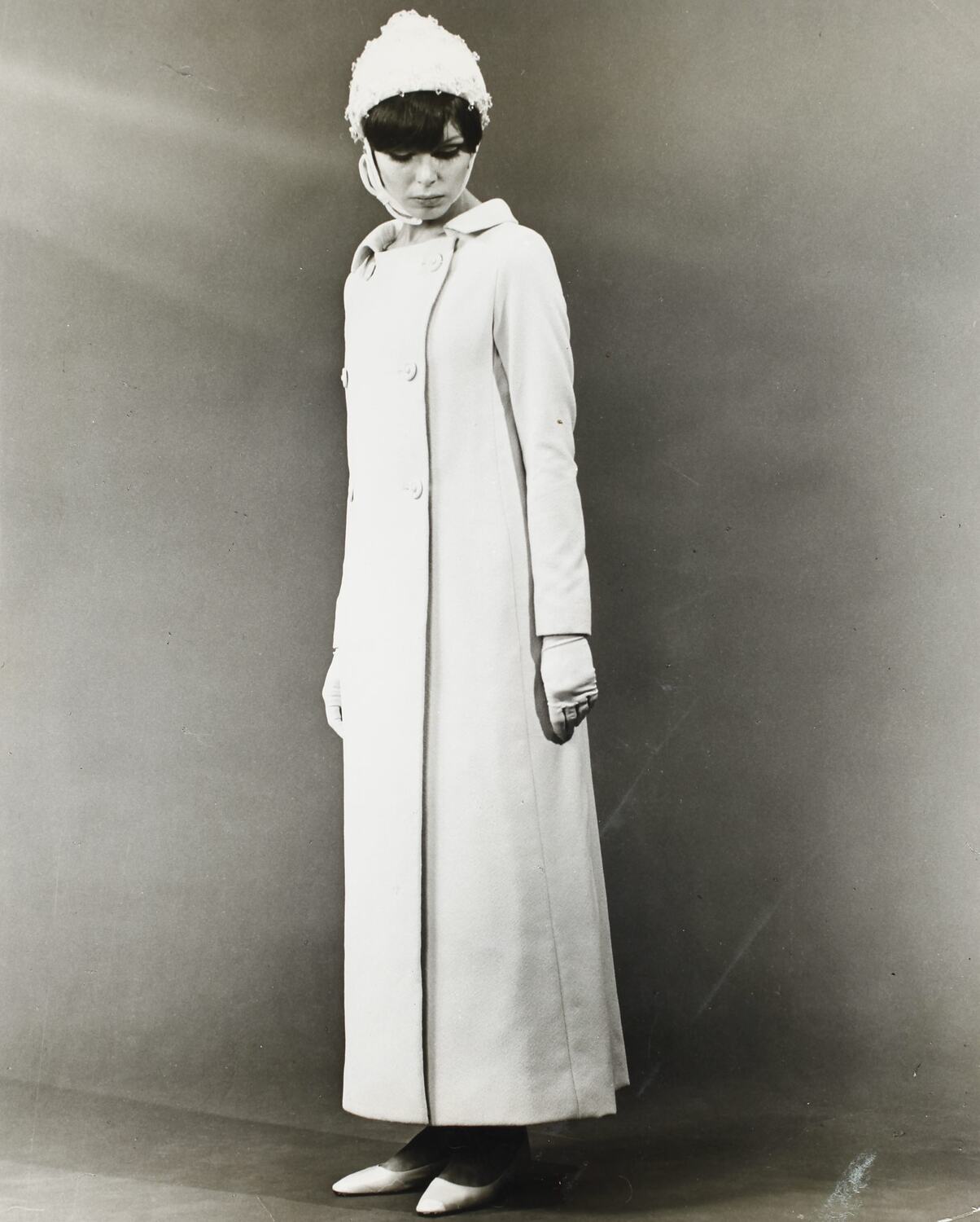 Photograph Model Wearing a Pink Crimplene Evening Dress & Coat