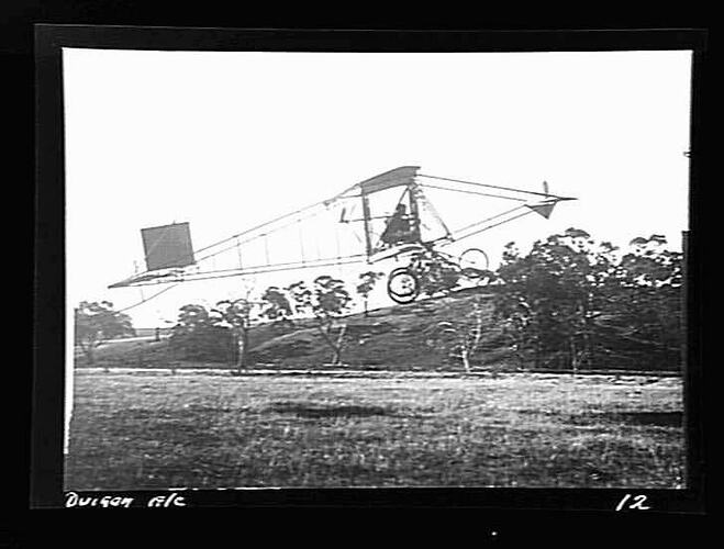 Negative - John Duigan & his Biplane in Flight, Mia Mia, Victoria, circa 1910