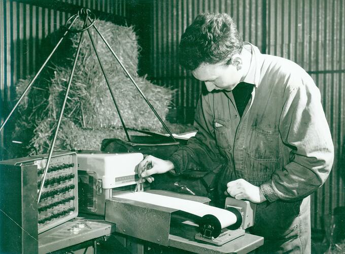 Man marking paper recording chart.