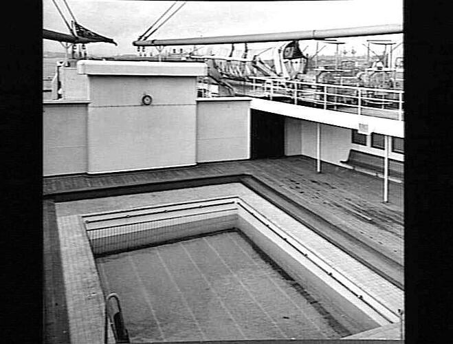 Ship deck with empty rectangular swimming pool.