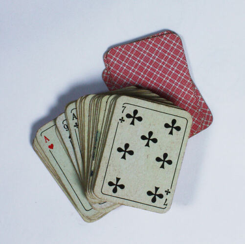 Deck of playing cards, with red back.