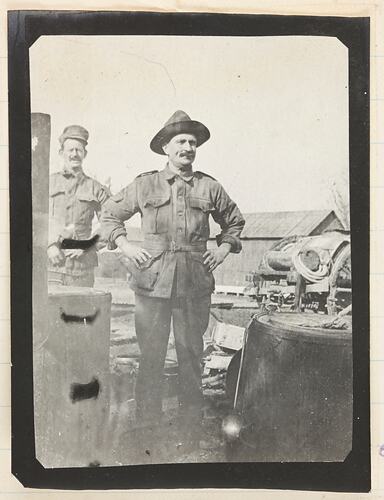 Two soldiers at an army camp.