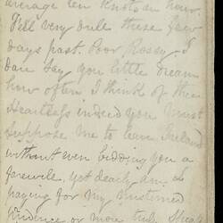 Open diary with handwritten text on discoloured worn page.