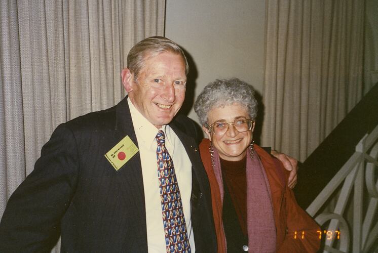 Two people smiling.